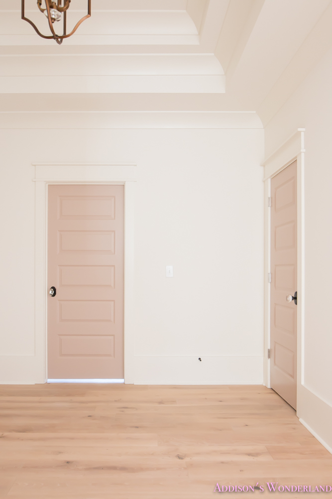 playroom-living-room-whitewashed-hardwood-floors-flooring-ceiling-rose-pink-doors-iron-baluster-staircase-white-walls-alabaster-sherwin-williams-3-of-19