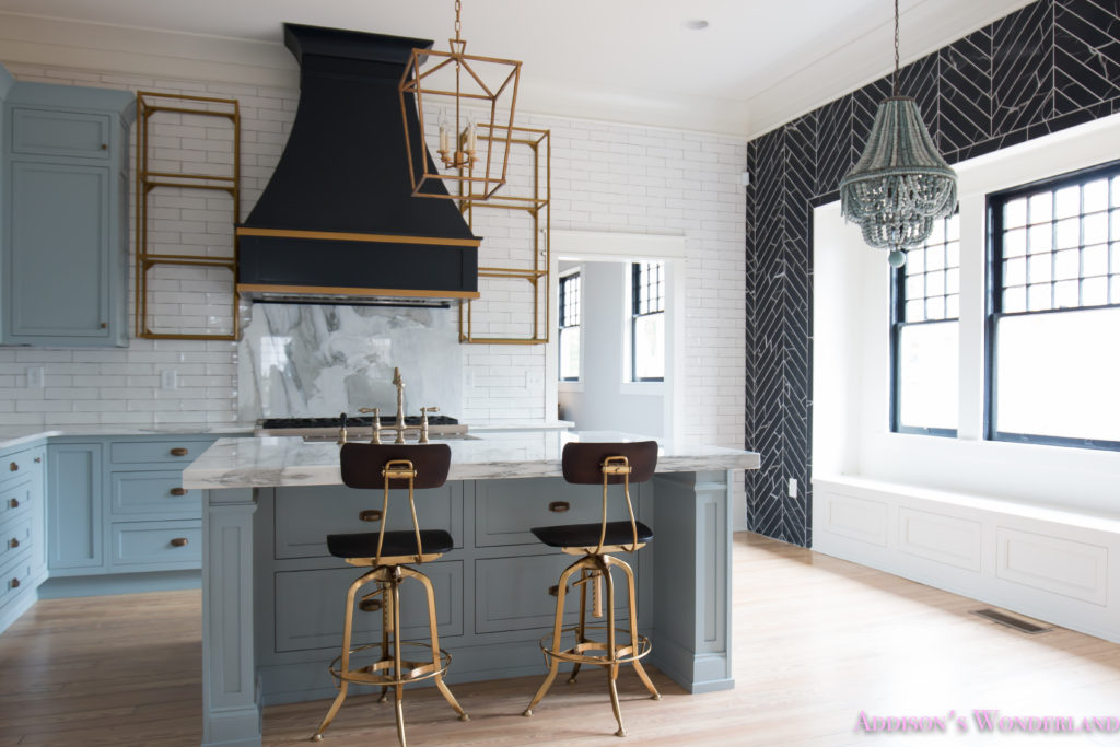 classic-vintage-modern-kitchen-blue-gray-cabinets-inset-shaker-black-gold-vent-hood-antique-brass-faucet-white-subway-backsplash-tile-gold-open-shelves-4-of-18